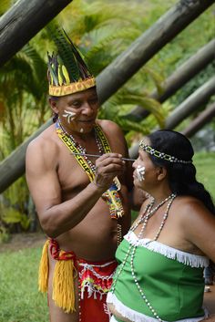 a man and woman dressed in native american clothing