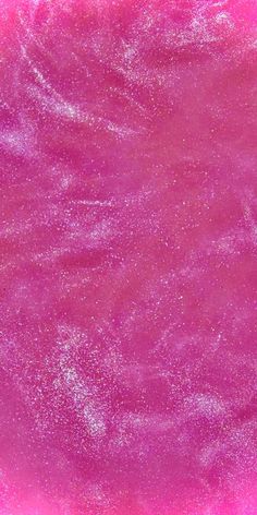 a pink and purple background with lots of white sprinkles on the surface