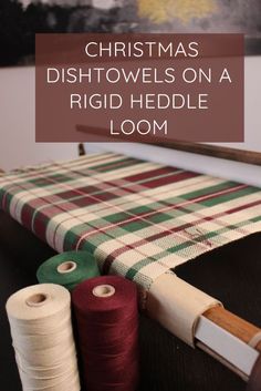 christmas dishtowels on a rigd heddle loom with spools of thread