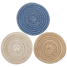 three round rugs in different colors and sizes on a white background, each with a blue