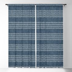 a blue curtain with white lines on it