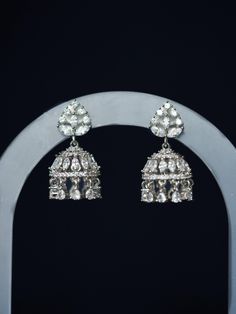 Adored for its dainty size and diamond-like sparkle, our Noori Mini Jhumka is a sophisticated silver CZ small jhumka perfect for everyday wear. This must-have unique South Asian earring is handmade and features white gold plating and shimmering cubic zirconia stones. Materials: Cubic zirconia, copper and brass alloy, rhodium plating Dimensions (L x W): 1.2 x 0.6 inches Weight: 5g (per mini jhumka) Mini Jhumka, Pakistan Jewelry, Small Jhumka, Silver Jhumkas, Copper And Brass, South Asian, Gold Plating, Dublin, Halloween Shopping