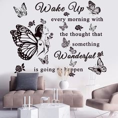 a living room with a butterfly wall decal on the wall and a quote above it that reads wake up every morning with the thought that something wonderful is going