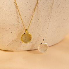 O R G A N I C ∙ F I N G E R P R I N T ∙ N E C K L A C E Capture cherished moments with our Organic Fingerprint Necklace, delicately shaped in a circle. Each necklace comes with a pressed circle charm, engraved with an actual fingerprint design, serving as a heartfelt tribute to love and connection. A thoughtful choice for Mother's Day, this necklace embodies the enduring beauty of maternal love, offering a timeless and meaningful gift for the special woman in your life ♡  * Material: High Qualit Fingerprint Design, Fingerprint Necklace, Traditional Ink, Fingerprint Jewelry, R P, Station Necklace, Engraved Jewelry, Engraved Necklace, Coin Necklace