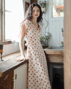 Retro V-neck Midi Dress For Summer, Vintage V-neck Dress For Summer Daywear, Cottagecore V-neck Dress With Ruffles, Vintage V-neck Dress With Ruffles, Vintage V-neck Dress For Garden Party, Retro V-neck Dress With Ruffles, Feminine Ruffled Tea-length Midi Dress, Summer Feminine Vintage Maxi Dress, Retro V-neck Maxi Dress For Summer