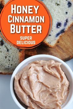 a white bowl filled with peanut butter next to slices of bread