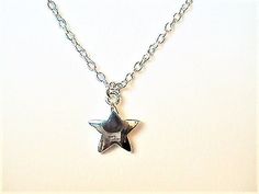 A silver star necklace with chain. A great gift idea for teens, teachers, women; a simple star pendant.A single silver plated star hangs from a sparkly silver plated trace chain; simple but pretty, excellent for Valentine's day.Length of opened chain approximately; 40cm / 16"Silver star charm approximately: 15mm /  0.59"Hangs roughly around the upper chest area.More handmade jewellery:https://www.etsy.com/uk/shop/ButterandBath?ref=seller-platform-mcnav&section_id=22489782Our Christmas gift s Silver Star Necklace, Jewellery Women, Teen Christmas Gifts, Christmas Jewellery, Teen Jewelry, Star Necklace Silver, Celestial Necklace, Gifts Under 10, Jewellery Gift