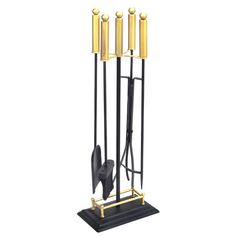 a black and gold metal candle holder with four candles on each side, one holding a pair of scissors