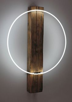 a light that is on the side of a wooden pole with a circle around it