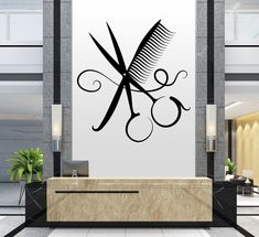 a wall mounted art piece with scissors on it