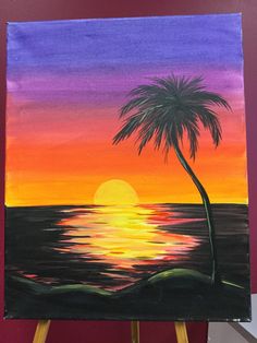 a painting of a palm tree and the sun setting over the ocean on canvases