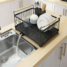 a kitchen sink filled with dishes and water