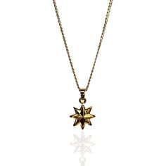 This star-shaped charm captures the celestial allure of the Sirius star.  A symbol of brilliance and mystique, it embodies the enchanting essence of the night sky.  Crafted with meticulous attention to detail, this charm radiates a sense of wonder and magic, just like the star that inspired it.  Let this charm be a reminder of the infinite possibilities that await, a token of your connection to the cosmic mysteries and your own inner light. GOLD PLATED 24K Made in Mexico  Avoid chemicals and lot Spiritual Yellow Gold Necklace With Star Charm, Gold Celestial Charm Necklaces In Brass, Celestial Yellow Gold Necklaces With Star Charm, Gold Celestial Pendant Necklace, Celestial Starburst Necklace With Star Charm, Sirius Star, August Birthstone Jewelry, July Birthstone Jewelry, Men's Jewelry Rings