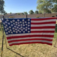 an american flag hanging on a clothes line