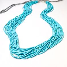 This 20 strand genuine turquoise necklace is sure to have you standing out in style, with genuine Navajo sterling silver clasp and turquoise heishi beads. Perfect for any boho-look lover, and an accessory that won't be leaving your neck anytime soon! This necklace is adjustable up to 30 inches long. SKU: #0630-2342 Heishi Necklace Navajo, Southwestern Multi-strand Turquoise Beads, Turquoise Multi-strand Beaded Necklaces With Tiny Beads, Turquoise Multi-strand Tiny Beads Necklace, Turquoise Multi-strand Beaded Necklaces, Turquoise Multi-strand Jewelry With Tiny Beads, Turquoise Multi-strand Tiny Beads, Giddy Up Glamour, Navajo Turquoise