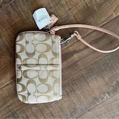 New With Tags Coach Blush Pink And Tan Wristlet Wallet. Tiny Mark On Bottom Corner - Shown In 3rd Picture. Coach Gold Wristlet For Everyday Use, Coach Gold Rectangular Wristlet, Gold Coach Wristlet For Everyday, Gold Rectangular Coach Wristlet, Coach Beige Pouch Wristlet, Beige Coach Pouch Wristlet, Coach Gold Clutch Wristlet, Coach Wristlet With Zipper Pouch For Daily Use, Gold Coach Clutch Wristlet