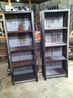 two wooden bookshelves sitting next to each other