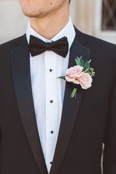 a man in a tuxedo with a boutonniere on his lapel