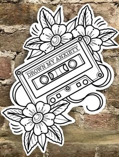 a sticker with flowers and an old fashioned cassette