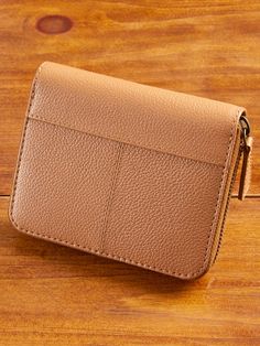 This wallet is made to last! It features goatskin leather, a premium leather famous for its supple texture, durability, and fine patina as it ages. It's designed with ample space to organize all your essentials, is not too thick or bulky, and features an accordion style and exterior zipper that opens wide enough to easily access the contents without spilling them. The simple design will complement a variety of purses and bags and is finished with handsome seaming. Slim-profile wallet with accordion-style opening Crafted of genuine goatskin leather with a pebbled texture Six card slots Half-length bill compartment Center zip coin pocket All-around outside zipper 5"Lx4"Hx 3/4"D Wallet, 100% goatskin leather; lining, 100% polyester Spot clean Imported Exclusive to The Vermont Country Store Co Classic Leather Coin Purse With Card Slots, Classic Leather Coin Purse With Rfid Blocking, Leather Bifold Coin Purse With Rfid Blocking, Classic Leather Coin Purse With Interior Card Slots, Brown Textured Leather Wallet, Classic Leather Bifold Coin Purse, Brown Textured Leather Wallet For Everyday Use, Brown Textured Leather Wallet For Daily Use, Brown Leather Coin Purse With Smooth Grain