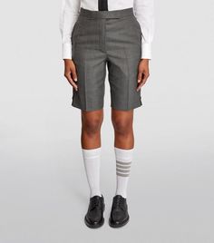 Find THOM BROWNE Wool Tailored Shorts on Editorialist. New York-based label Thom Browne is renowned for its adoration of uniformed dressing - something that comes to the fore in all its expertly tailored separates. No exception, this pair of shorts is cut from comfortable wool to a classic Bermuda silhouette. Pair them with the labels knee-high socks for an ultra-preppy look. Distressed Bermuda Shorts, Tailored Shorts, Preppy Look, Short Coat Jackets, Swimwear Shorts, Knee High Socks, Field Jacket, Short Coat, T-shirt Polos