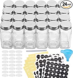 the mason jars are filled with black and white stickers