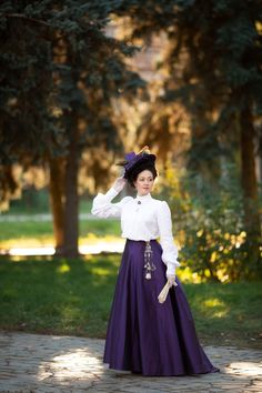 Fan skirts or umbrella skirts came into fashion starting in 1894 and were very popular until the end of the 19th century.   A simple cut in the form of wedges and  a narrow waist created an A-line silhouette that kept balance with the fashionable gigot sleeves that time. Skirts were simple and laconic often with a contrasting belt. The bodices of ball or walking costumes, as a rule, were richly decorated and had large gigot sleeves. Progressive ladies of the 19th century also wore this type of skirts with white shirts. The skirt is fitted around the hips with darts, which has much more pleating in the back and fullness in the hem. The skirt is made of ink-violet synthetic smooth taffeta, has a hook-and-eye closure at the back, a placket in the cut hidden by pleats. The hem of the skirt is Costume Full Gathered Skirt, Costume Full Skirt With Gathered Details, Victorian Petticoat For Costume, Vintage Full Skirt For Costume, Vintage Costume Gathered Skirt, Vintage Gathered Skirt For Costume, Fitted Vintage Skirt With Historical Design, Victorian Style Fitted Full Skirt, Vintage Flared Skirt For Formal Occasions