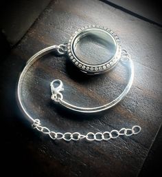 What you will receive: 1-Large (30mm) Silver Stainless Steel Floating Locket Bar Bracelet with a Crystal Magnetic Face One Size fits all (adjustable bracelet chain included) You can check out my pre-designed floating locket combinations here: https://www.etsy.com/shop/PrettyPalazzo?section_id=15744730&ref=shopsection_leftnav_4 Shipping: Orders are shipped out within 1-2 business days. Most orders can be shipped out the same day if they are ordered before 3pm Eastern Time. Great care is taken Nickel-free Silver Stainless Steel Jewelry, Antique Silver Metal Jewelry With Lobster Clasp, Adjustable Nickel-free Silver Crystal Bracelet, Silver Crystal Bangle Bracelet As Gift, Elegant Silver Jewelry With Interchangeable Details, Silver Stainless Steel Jewelry For Jewelry Making, Adjustable Round Locket Jewelry, Adjustable Silver Crystal Chain Bracelet, Anniversary Jewelry With Lobster Clasp In Stainless Steel