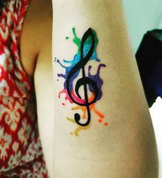 a woman with a colorful tattoo on her arm