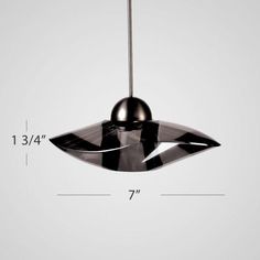 a black and white pendant light hanging from a ceiling fixture with measurements for the length