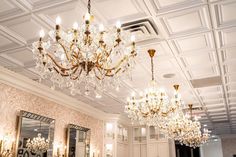 a chandelier hanging from the ceiling in a fancy room