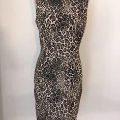 Elegant And Flattering Black And Cream Cheetah Dress With Back Exposed Zipper. Very Chic!! Length - From Top Of Shoulder To Hem - 37 1/2 Inches Bust - 38 Inches Approx. Hip - 40 Inches Approx. Fabric Content - 75% Viscose, 12 % Polyester, 10 % Nylon And 3% Spandex Care - Dry Clean Only Sleeveless Stretch Mini Dress In Leopard Print, Fitted Sleeveless Mini Dress In Leopard Print, Chic Sleeveless Leopard Print Dress, Chic Sleeveless Leopard Print Bodycon Dress, Chic Leopard Print Sleeveless Dress, Sleeveless Stretch Leopard Print Bodycon Dress, Stretch Leopard Print Sleeveless Bodycon Dress, Stretch Sleeveless Leopard Print Bodycon Dress, Chic Leopard Print Sleeveless Bodycon Dress