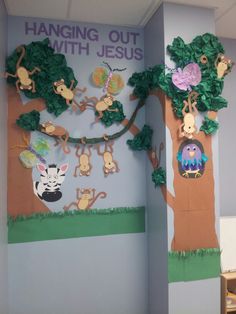 the hanging out with jesus bulletin board has animals and trees on it's sides