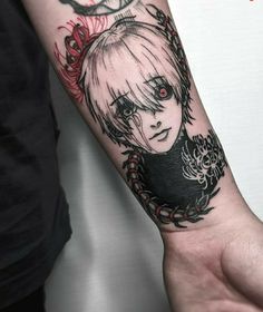 a woman's arm with an anime tattoo on the left side of her arm