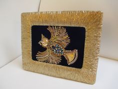 This lovely piece measures approximately 9 3/4 x 7 3/4 inches on the outside edges of the gold tone tabletop frame. Backed by lovely royal blue velvet; vintage, rhinestone and detailed elements make up this fabulous piece. Handmade and completely unique, this beautiful item would make a lovely gift or for your own home. Thanks for looking! My jewelry art is composed of both new and vintage elements but as these beautiful pieces are handed down through families and generations, the intricate elem Gold Embellished Jewelry For Formal Occasions, Vintage Jewelry With Peacock Design As Gift, Vintage Jewelry Art Traditional, Vintage Jewelry Fish Art, Vintage Jewelry Art Bird, Vintage Jewelry Art Ballerina, Blue Jay Bird, Jay Bird, Blue Velvet