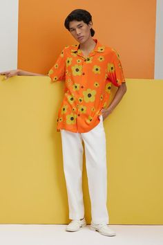 Orange shirt with flower prints and button placket.
Components: 1
Pattern: Printed
Type Of Work: Flower
Neckline: Shirt collar
Sleeve Type: Half
Fabric: Fluid cotton 
Color: Orange
Other Details: 
Stretch: No stretch
Model height: 5ft 11inches, wearing size S
Note: The pant worn by the model is not for sale
Occasion: Resort - Aza Fashions Spring Vacation Camp Shirt With Collared Neckline, Summer Floral Print Hawaiian Shirt, Casual Collared Blouse With Floral Print, Spring Printed Shirt With Camp Collar, Printed Camp Collar Shirt For Spring, Summer Patterned Button-up Shirt, Patterned Shirt With Plant Print For Summer, Patterned Printed Hawaiian Shirt For Spring, Orange Floral Print Shirt For Vacation