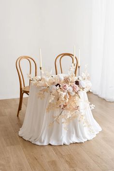 the table is decorated with flowers and candles