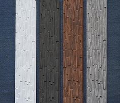 four different colored wood planks are lined up in rows on a blue fabric background