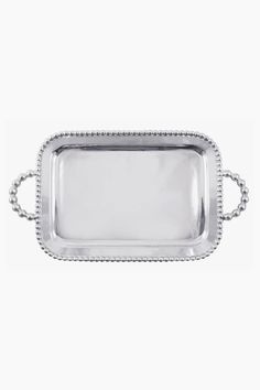 a silver tray with beaded handles