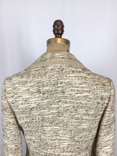 "Vintage 1960s cream woven textured silk suit blazer V-neck Notched collar trimmed in satouche ribbon which runs down front, along hem, pocket flaps and sleeve hems Four creamy marbled buttons down front for closure Darts and seams for a fitted fit Two faux flap pockets at front Long sleeves with a straight hem and trimmed with a single button Back has shoulder darts, and princess darts Lined in beige nylon MEASUREMENTS: Fits like a Medium Blazer: Shoulders: 16\" Bust: 36\" Waist: 32\" Hips: 38\ Formal Cream Tweed Jacket, Classic Fitted Cream Tweed Jacket, Cream Wool Blazer For Office, Fitted Cream Single Breasted Tweed Jacket, Cream Single Breasted Tweed Jacket For Spring, Formal Cream Tweed Jacket For Fall, Cream Tweed Jacket For Formal Fall Occasions, Spring Cream Tweed Blazer, Fitted Cream Tweed Outerwear