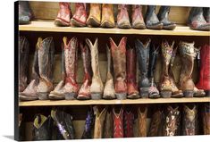 several rows of cowboy boots lined up on shelves