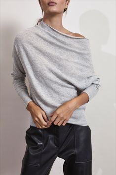 The Lori Off Shoulder sweater is the ultimate in sensuality. In a finely knit cashmere that is beyond luxe, its feminine and versatile neckline allows you to transform your look. Designed to be worn as a boat neck for a more casual sensibility or off the shoulder for a bit of drama, its chameleon nature will make it an instant favorite. With gorgeous ribbed cuffs and hem, this lightweight sweater isn’t just an essential, it is iconic Brochu Walker. Brochu Walker, Off Shoulder Sweater, Gray Sweater, Lightweight Sweater, Classic Outfits, Pull On Pants, Shoulder Sweater, Light Weight Sweater, Boat Neck