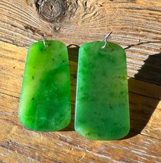 These large earrings feature thin slices of genuine Canadian nephrite jade stud. Each piece of jade measures 42mm long x 23mm wide (1.65 inches x 0.90 inches). The hooks are 925 sterling silver. 30 day satisfaction guarantee! Jade is a natural stone, so the shade of color may vary slightly. All of our jade is grade A, unless otherwise noted. It is 100% Pure Nephrite Jade, with no treatments whatsoever. What is Jade? Jade is one of two gemstones, nephrite jade or jadeite jade. Nephrite jade , (a Nephrite Jade, Jade Earrings, Large Earrings, Natural Stone, Jade, 925 Sterling Silver, Pure Products, Gemstones, Sterling Silver