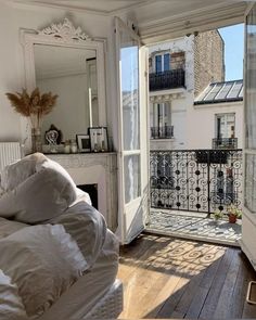 an open door leading to a bedroom with a balcony