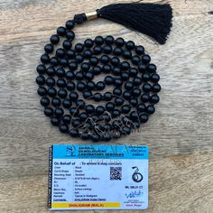 Shaligram Mala brings immense wealth and very good health to the wearer. Peace of mind and protection are its some effect which is immediately seen. It is considered very auspicious. Wearing of Shree Shaligram mala bestows the devotee with extreme protection and peaceful environment. ✨ MALA DETAILS ✨ 🍭Shaligram Beads  🍭All-Natural Round Beads 🍭Polyester Silk Tassels (A Vegan Alternative to Silk) 🍭Silver Zari  🍭Mala Necklace Length: 37.0- 38.0 inches approx 🍭Mala Beads Size: 8.0-8.5 MM 🍭Nu Black Beads Mala For Meditation, Black Beaded Mala For Meditation, Spiritual Black Beaded Round Necklaces, Saligram Stone, Tibetan Mala, Green Tiger Eye, Knotted Mala, Silk Tassels, Peaceful Environment