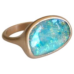 Dalben design 18k rose gold satin finishing ring with a 9,7 carat bezel-set organic shape magnificent Queensland mine Australian boulder opal . The Australian Opal have blue , pink and green spots. Ring size US 7 1/4- - EU 55- re-sizable to most finger sizes. Bezel setting dimension: width 21,1 mm, height 14,5 mm. The ring has been designed and handcrafted in our atelier in Italy Como with a rigorous quality workmanship . For a faster shipping service please choose "Buyer arranged shipping Free" Modern Oval Opal Ring, Modern Oval Opal Ring With Bezel Setting, Opal Rose Gold Ring, Rose Gold Satin, Rose Gold Opal Ring, Australian Boulder Opal, Gold Satin, Australian Opal, Boulder Opal