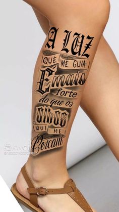 a woman's legs with tattoos and words on the leg, in black ink