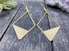 "These geometric statement earrings feature 56mm x 27mm raw brass geometric diamonds. These minimalist geometric earrings will complement any outfit, and are lightweight enough for all day wear! The earrings measure approximately 2 15/16 inches from the bottom of the diamond to the top of the ear wires, which are made of hypoallergenic gold-plated surgical steel, making them safe for sensitive ears. These earrings are very lightweight, each weighing 0.1 ounce. Domestic shipping is always free he Geometric Brass Earrings For Gift, Geometric Metal Earrings For Everyday, Everyday Single Geometric Earring, Everyday Geometric Single Earring, Geometric Metal Earrings With Ear Wire, Modern Geometric Nickel-free Earrings, Modern Nickel-free Geometric Earrings, Nickel-free Geometric Brass Earrings, Modern Gold Geometric Earrings