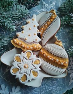 decorated cookies are sitting on a platter