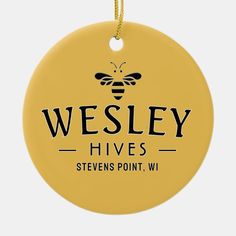 a yellow round ornament with the words westley hives on it